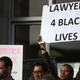 Protesters hold signs during a “Hands Up, Don’t Shoot” demonstration in front of the San Francisco Hall of Justice Dec. 18, 2014.
Justin Sullivan/Getty Images